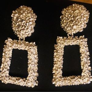 Silver toned earrings